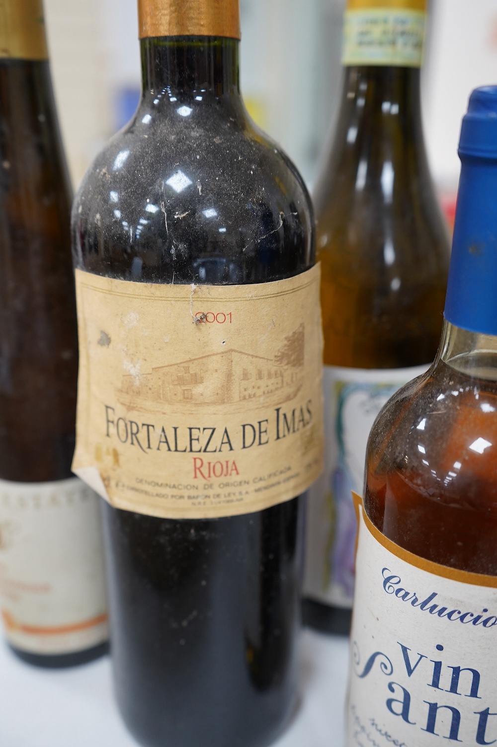 Nine and a half bottles of mixed Italian, South African and German wines. Condition - unknown storage
